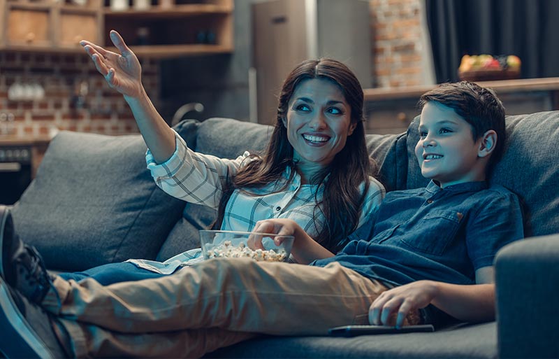 Mother and son watching TV