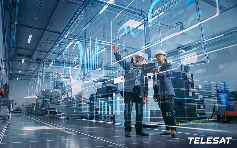 Two men wearing white hard hats in a warehouse working together on glass whiteboard