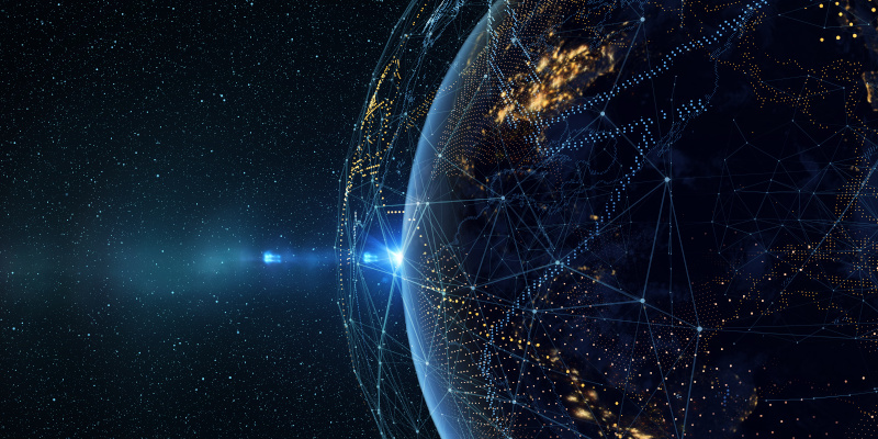 Earth from space at night covered with constellation of satellites.