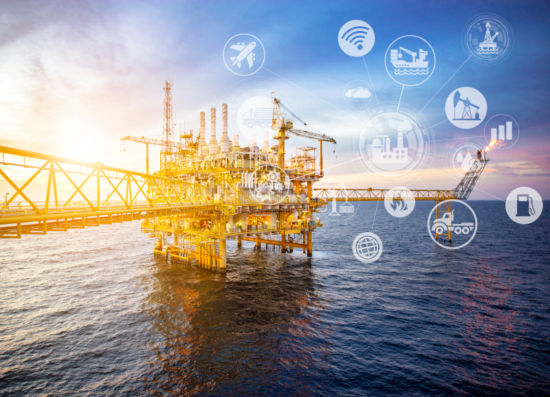 Offshore oil and gas platform with digital connectivity icons representing satellite communications for remote energy operations
