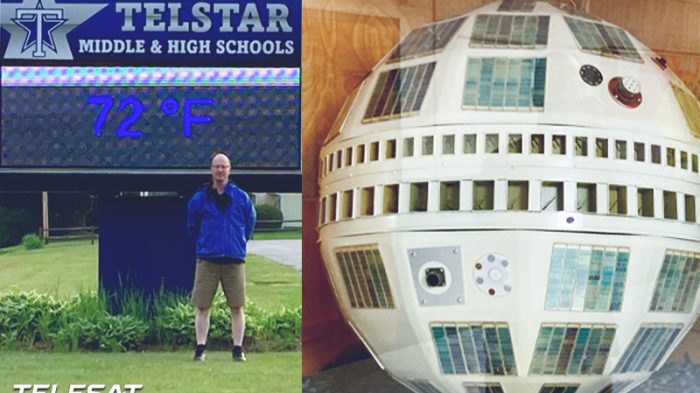 Matt Wuhr standing in front of Telstar High School sign located in Bethel Maine along with image of first Telstar satellite