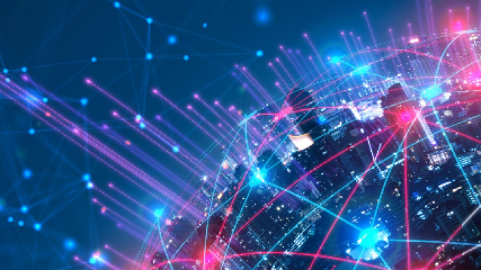 Conceptual image of Earth with a visible city. Dots connected by lines represent a web connectivity network around Earth.